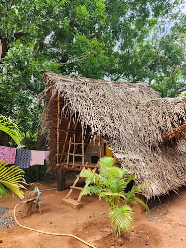 Inside the Double Hut — handmade pillows on the bed